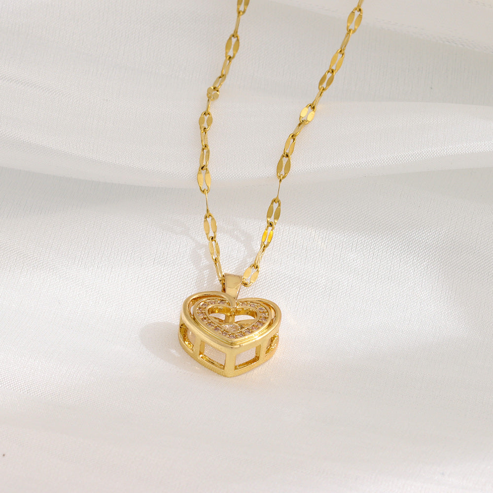 Close-up of heart-shaped pendant with rhinestones on double layer titanium steel necklace