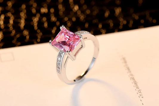 Close-up of sapphire-inspired ring showing white metal finish