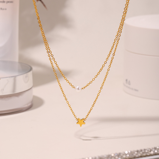 Displaying celestial star layered necklace showing double chain design