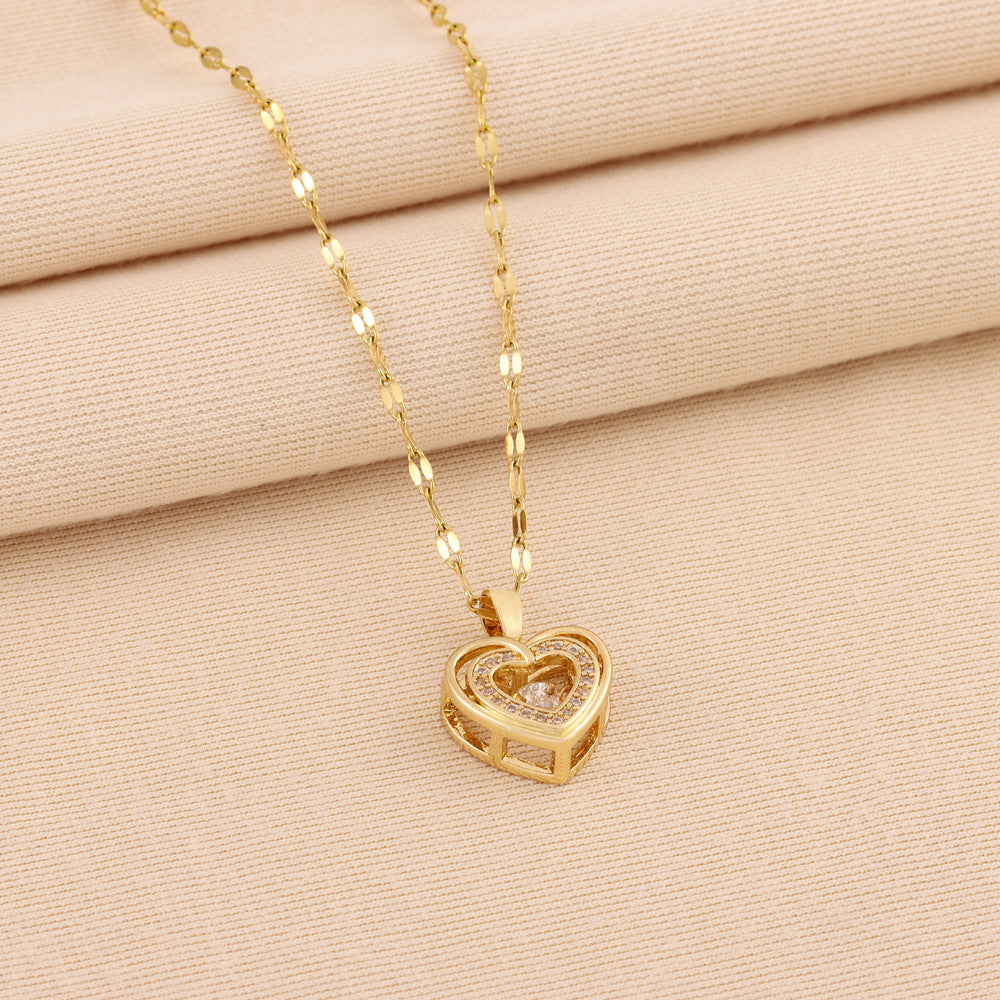 Double layer love necklace laid flat showing full length titanium steel chain and heart pendant