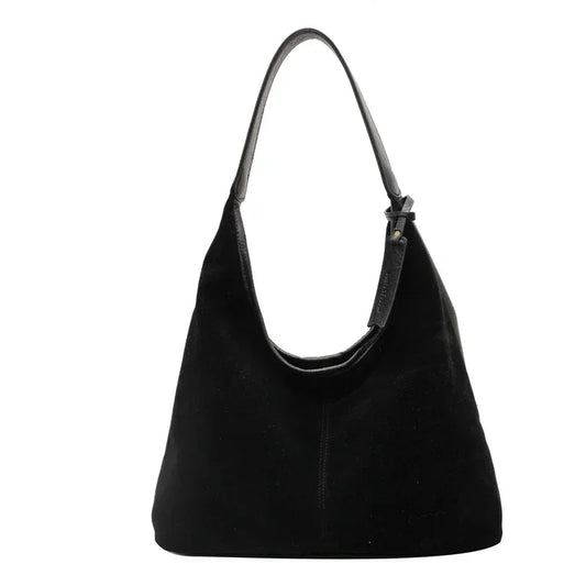 Black handbag on a white background
