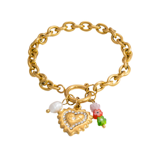 A gold-colored bracelet with a clavicle chain design, featuring a gold pearl pendant, a gold heart pendant with clear zirconia, 3 multi color flower pendant.