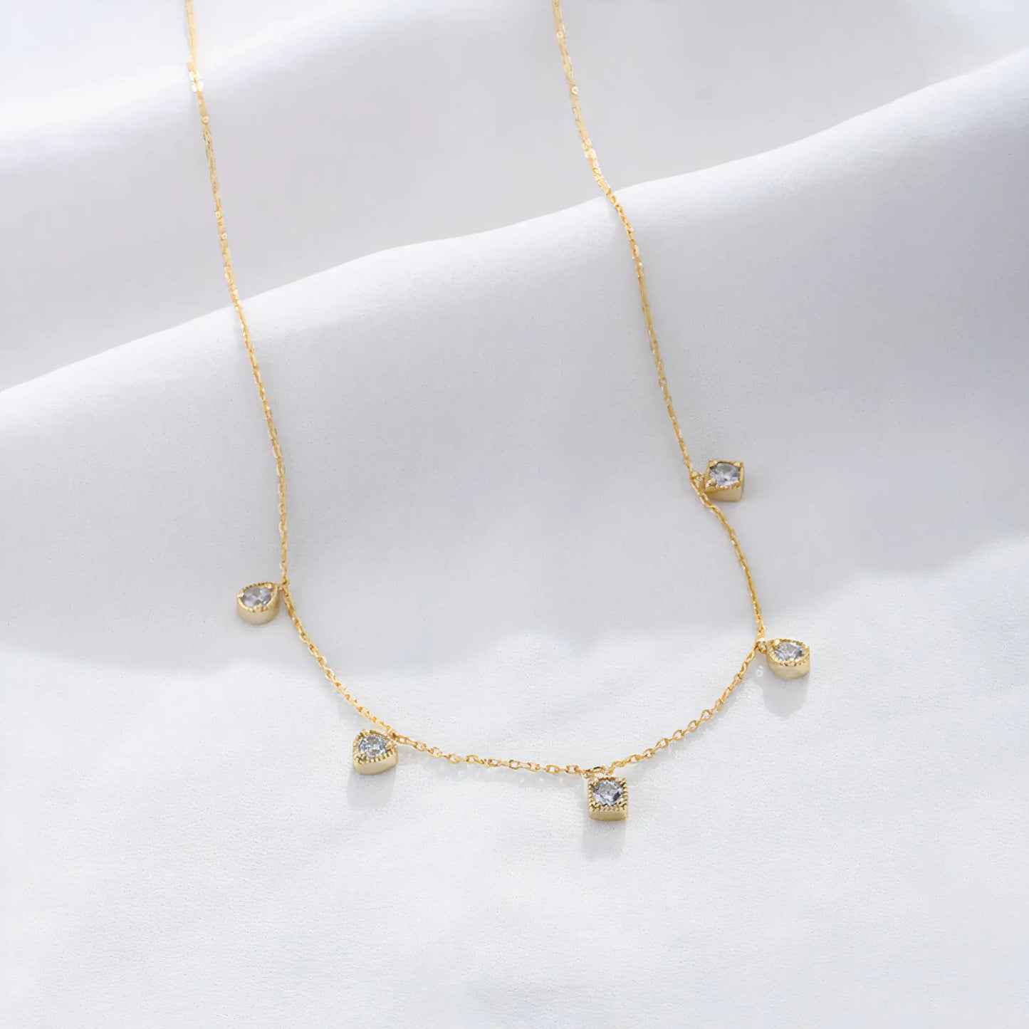 Arden Necklace – Dainty 20K PVD gold necklace with spaced CZ drop stones, perfect for layering and daily wear.