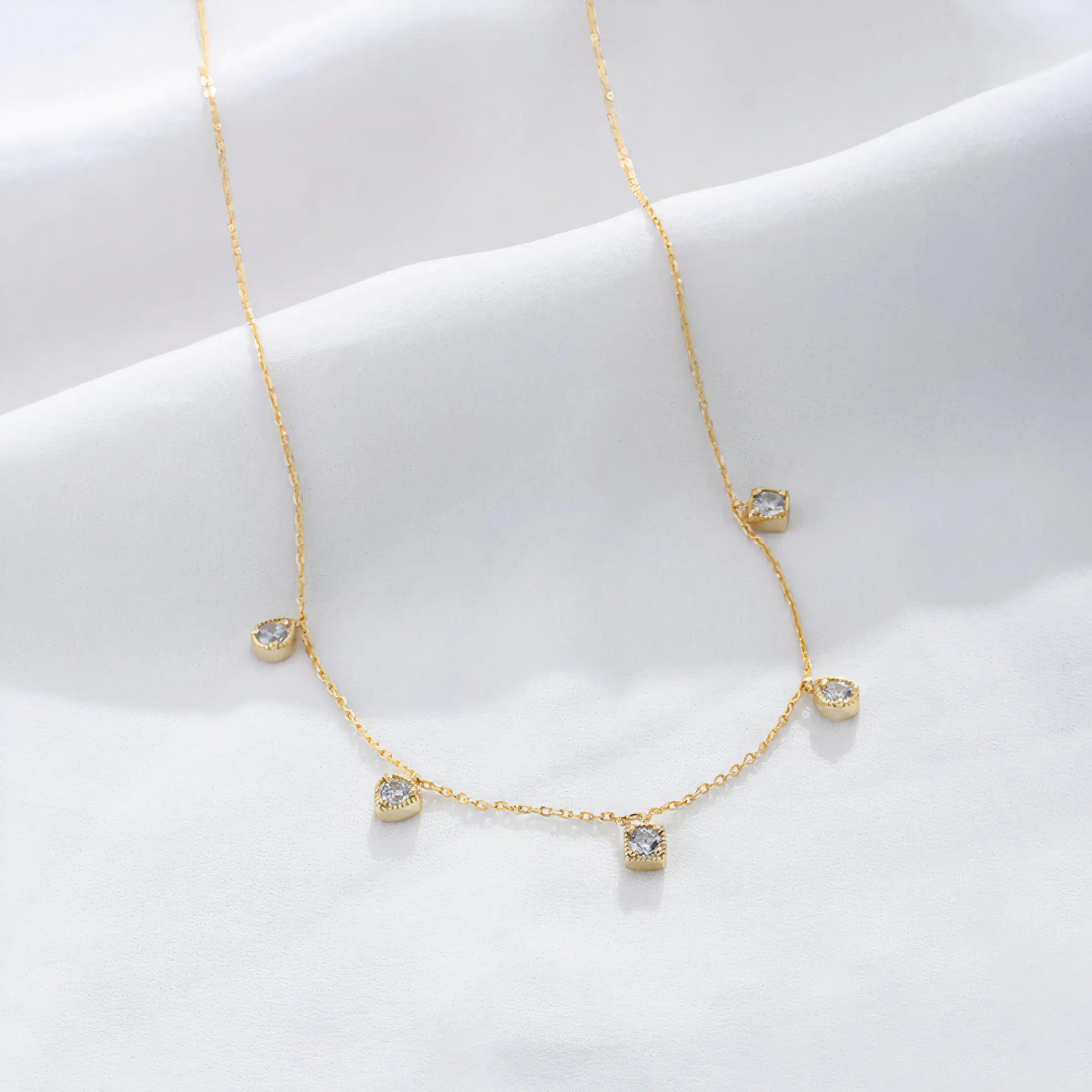 Arden Necklace – Dainty 20K PVD gold necklace with spaced CZ drop stones, perfect for layering and daily wear.