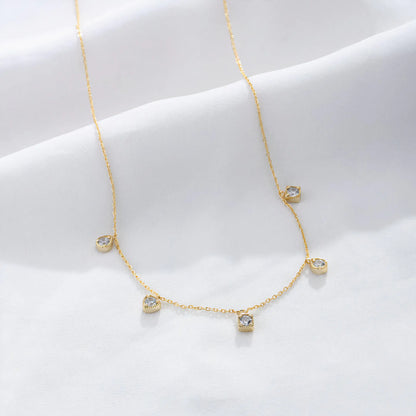 Arden Necklace – Dainty 20K PVD gold necklace with spaced CZ drop stones, perfect for layering and daily wear.