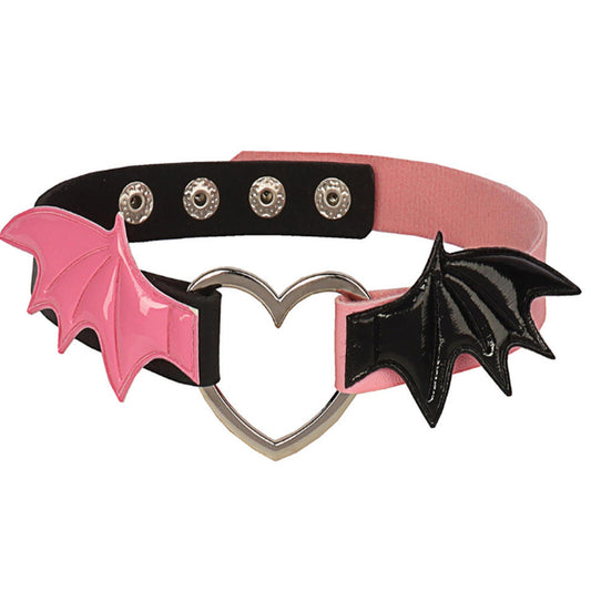 Pink and black choker with bat wings and a heart-shaped clasp on a white background