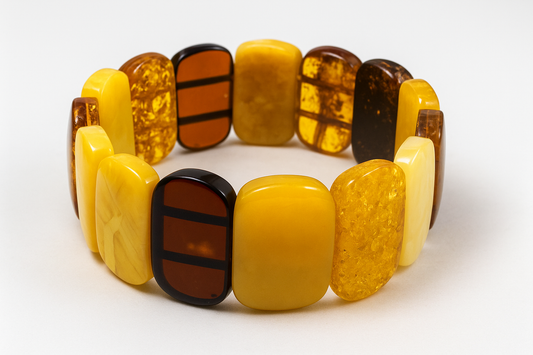 Multicolored amber bracelet on a white background baltic