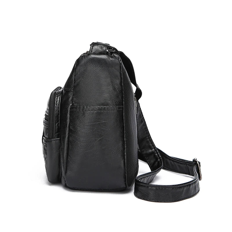 Black leather backpack on a white background