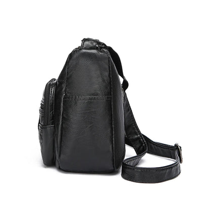 Black leather backpack on a white background