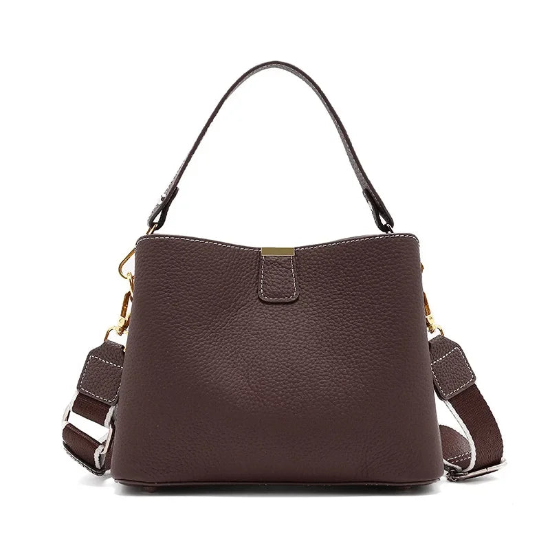 Brown handbag with a strap on a white background