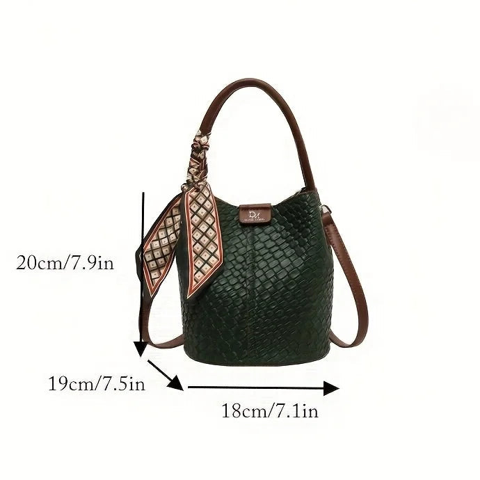 Green handbag with measurements on a white background.