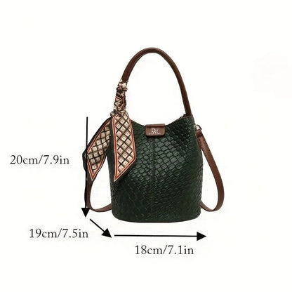 Green handbag with measurements on a white background.