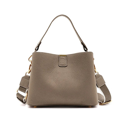 Gray handbag with a strap on a white background