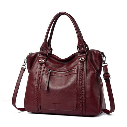 Brown handbag with a shoulder strap on a white background. MYH