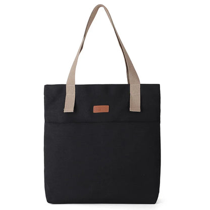 Black tote bag with beige handles on a white background