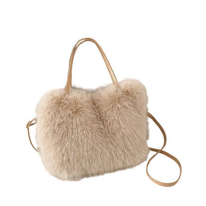 Beige fluffy handbag with a strap on a light surface