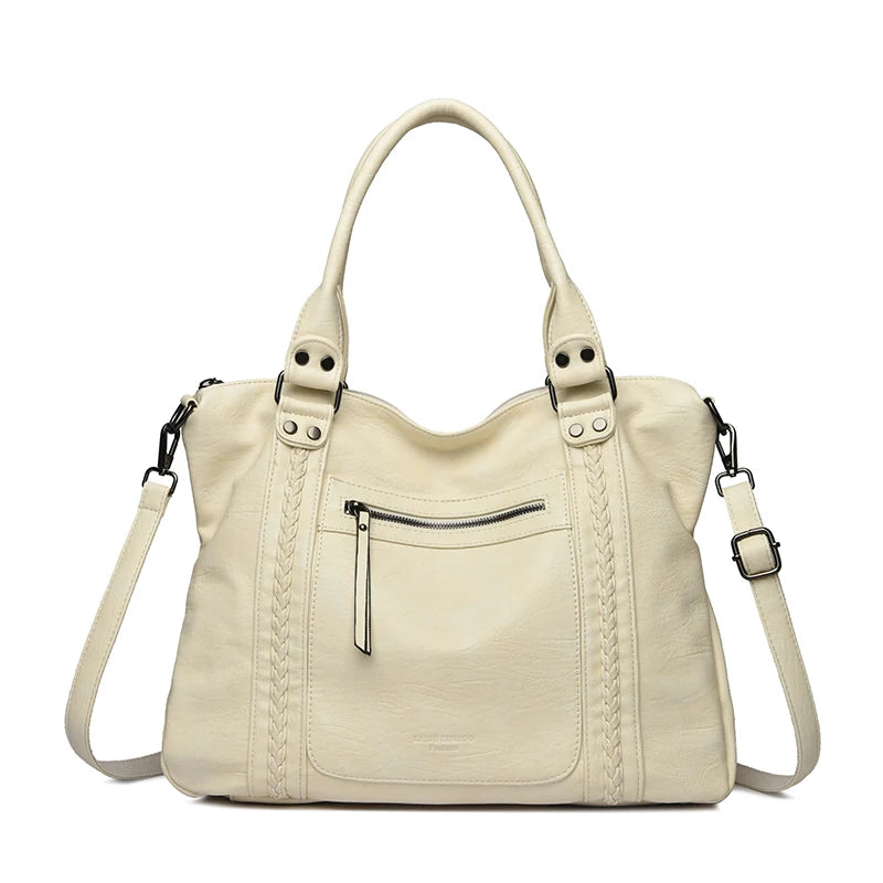 Beige handbag with braided details on a white background