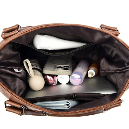 Open brown bag with various items including a phone and bottles