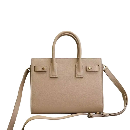 Beige handbag with a strap on a light gray background