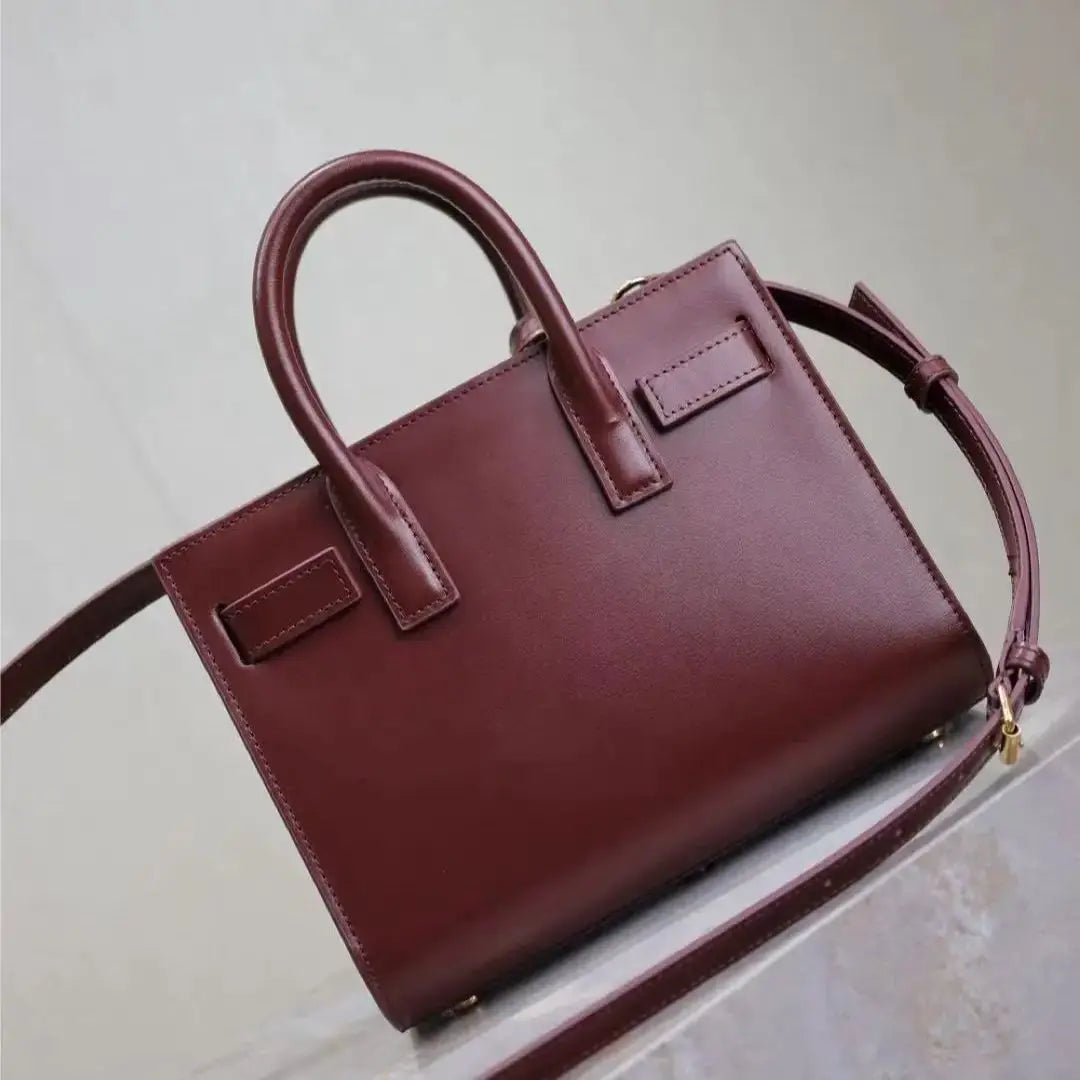 Maroon handbag on a light background