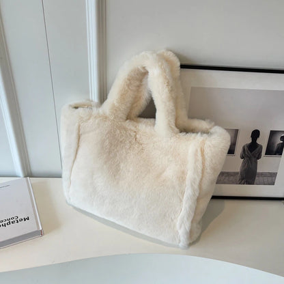 White fluffy handbag on a white surface with a minimal background