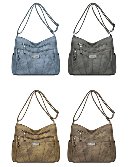Four shoulder bags in different colors on a white background
