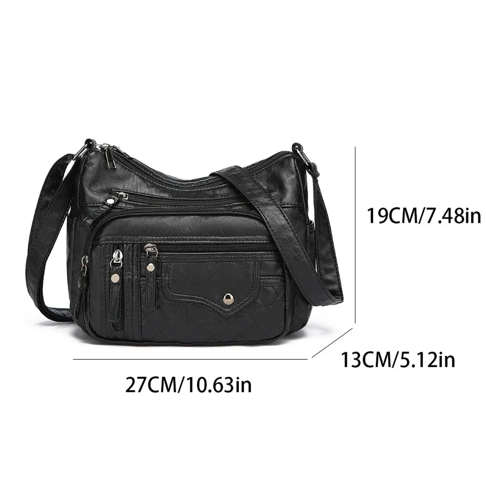 Black leather handbag with measurements on a white background