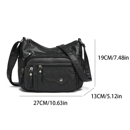 Black leather handbag with measurements on a white background