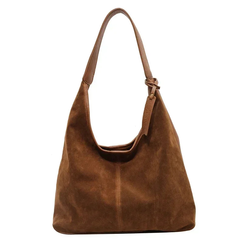 Yellowish Brown leather handbag on a white background