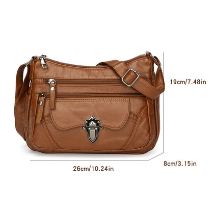 Brown leather handbag with measurements on a white background