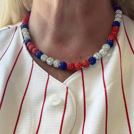 Red, white, and blue baseball bling necklace with crystal-inlaid beads from the COGU Ice Collection, designed for athletes and sports fans.