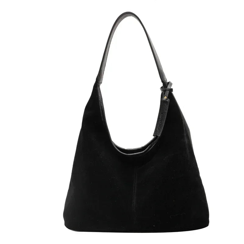 Black handbag on a white background