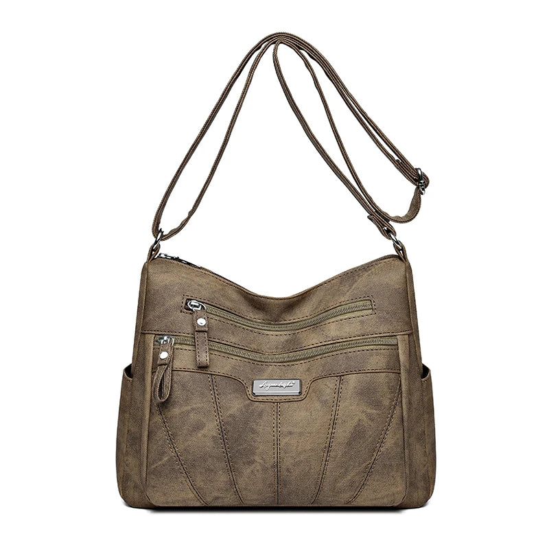 Brown shoulder bag with multiple pockets on a white background