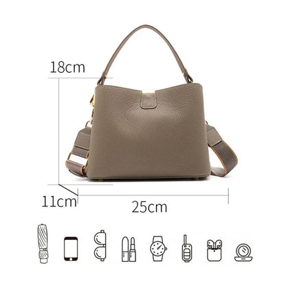 Brown handbag with measurements on a white background