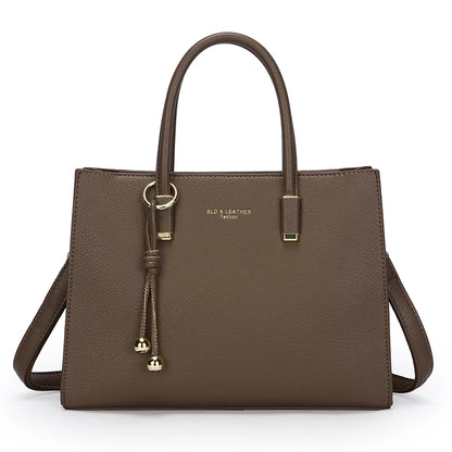 Elephant Grey leather handbag with a strap on a white background